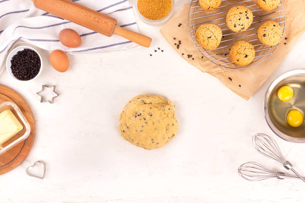 istock The process of making cookies, step by step. Culinary equipment and ingredients. Eggs, flour, sugar, chocolate, butter, bakeware. Flat lay. 1208522654