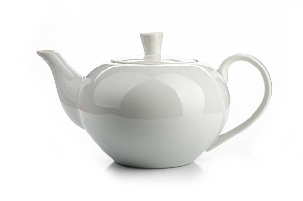 istock a white teapot on a white background, isolated 1208522783
