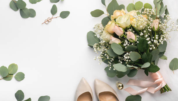 istock Bridal attributes bouquet and high heel shoes 1208522799