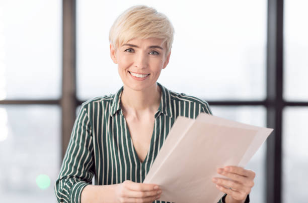 istock Businesswoman Working With Papers And Documents Sitting At Workplace 1208522861