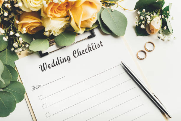 istock Bridal stuff wedding rings and bridal bouquet on white 1208522897