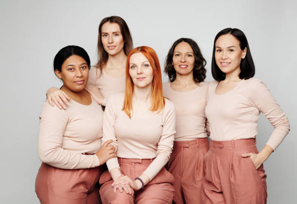 istock Group of different multi-ethnic women wearing same outfits but having unique appearances 1208523521