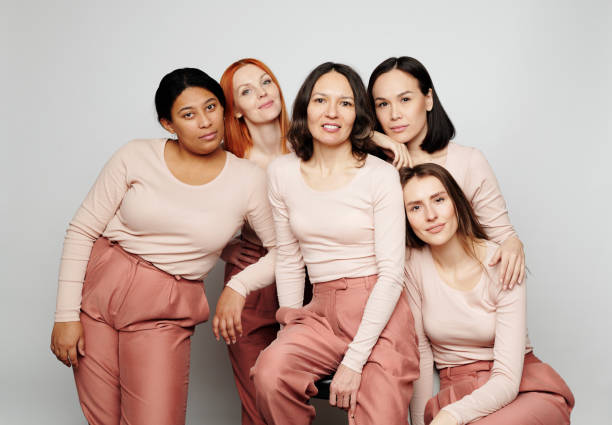 istock Group of diverse friendly multi-ethnic women standing together and looking at camera 1208523523