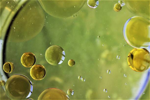 istock Abstract drop of oil vinegar on water background 1208525657