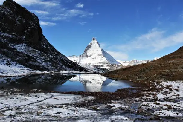 Matterhorn mountain and riffelsee lake view from rotenboden railway station photo