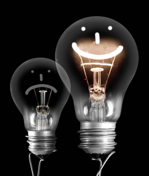 istock Dark and Shining Light Bulbs with Positive and Negative Emotion 1208527357