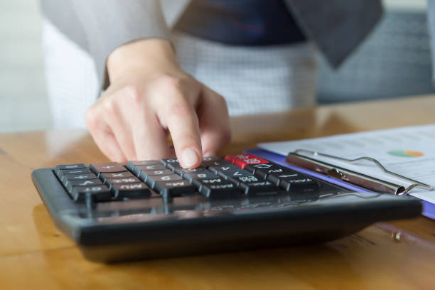istock Midsection Of Woman Using Laptop On Table 1208527399