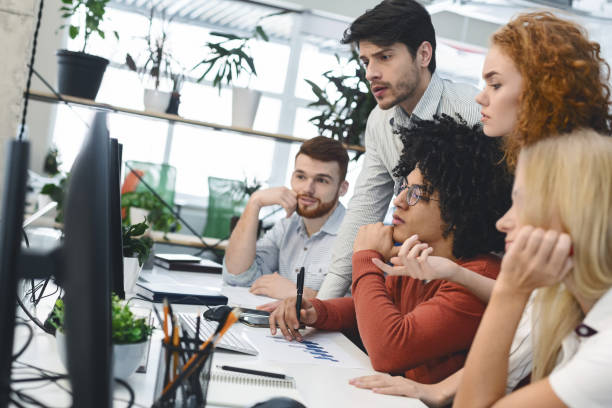 istock Concentrated international team discussing job, looking for creative solution 1208528725