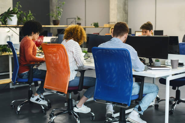 istock Young creative team working on business project at coworking space 1208529259