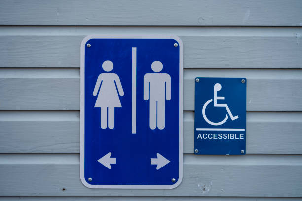 istock Restroom signs on a wood wall 1208532654