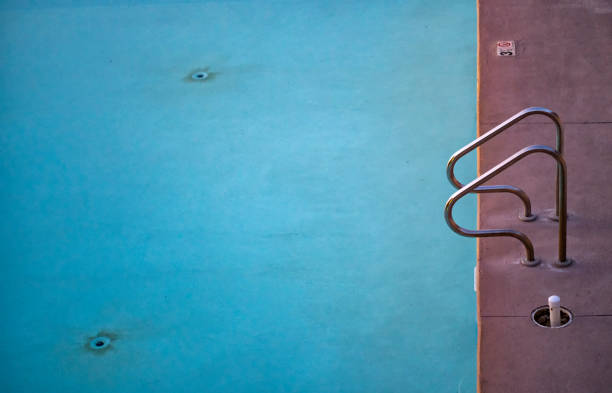 istock Swimming pool with no body at sunset 1208532740