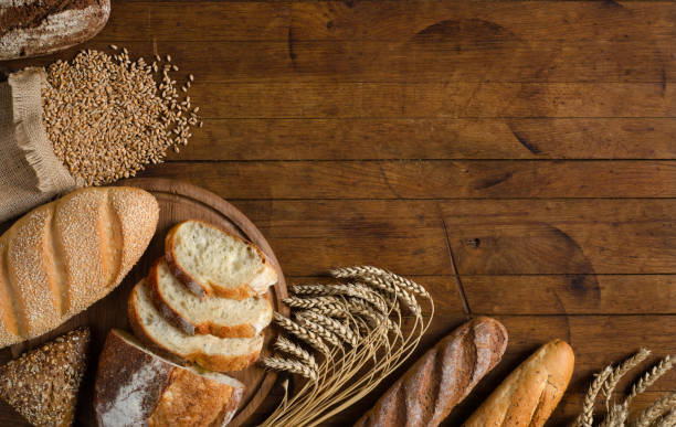 istock Assortment bread products on wooden table. 1208533008