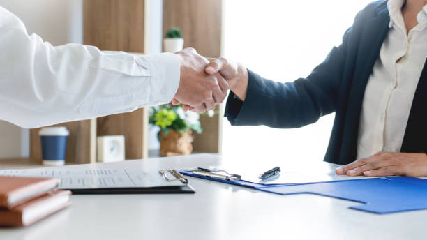 istock Midsection Of Candidate And Manager Shaking Hand In Office 1208533185