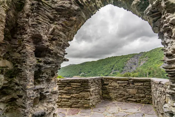 Photo of Stone archway of an ancient castle tower in the Welsh countryside