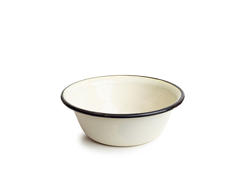 Old enamel dishe, or bowl, isolated on white background