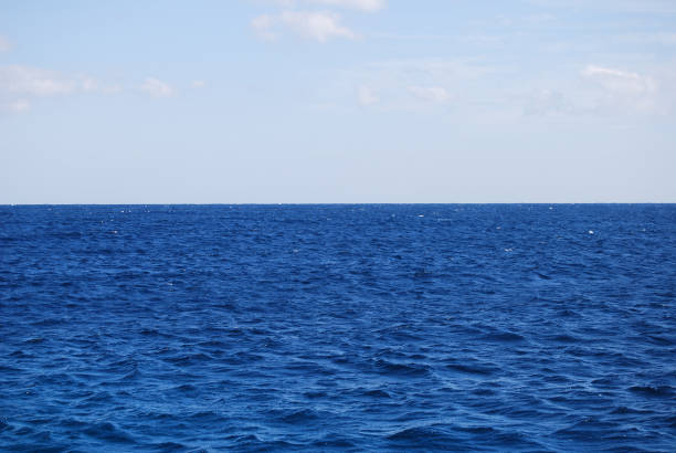 istock Blue sea with light wavy water 1208535166