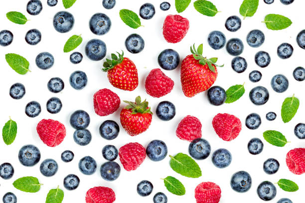 istock Summer Food Pattern with Fresh berries isolated on white background, top view. Strawberry, raspberry, mint leaf. Mix Berry  Flat lay. 1208536220