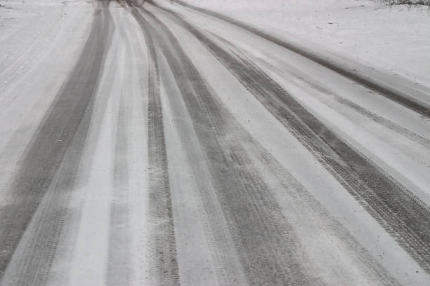 istock car tracks on the road covered with fresh snow 1208538177
