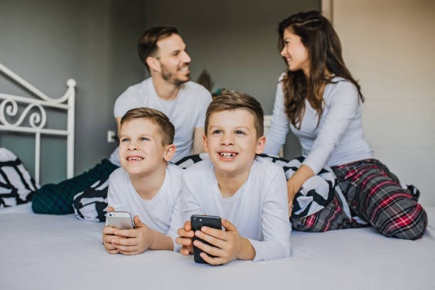 istock Happy young family in bed 1208539481