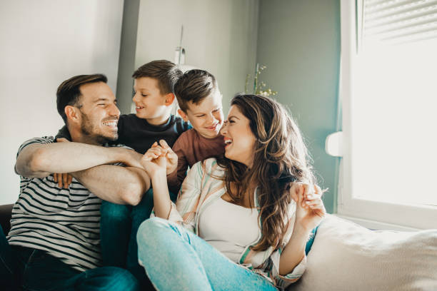istock Happy young family with two sons 1208539744