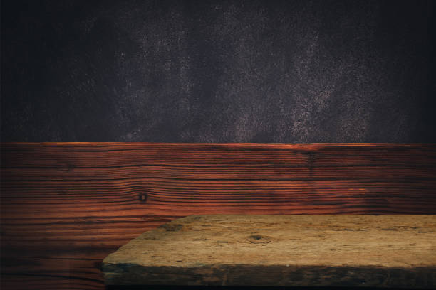 istock Old oak Wooden table and brown wood background wall. 1208540020