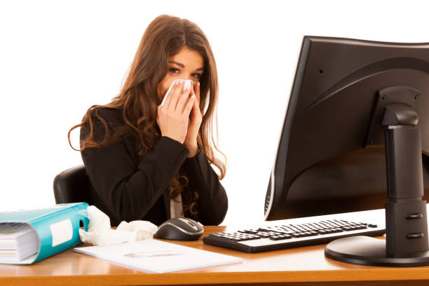 istock Young business woman working ill in office suffering - ilness  at work 1208540128