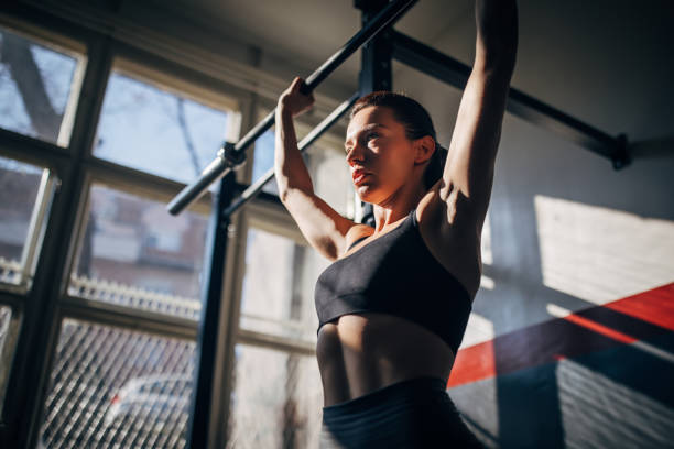 istock Fit young woman training alone in gym 1208541593