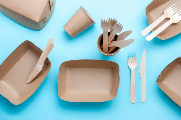 istock Brown kraft paper food containers on blue background 1208543179
