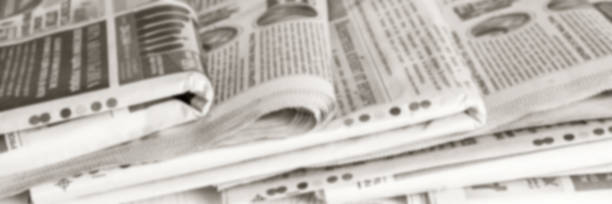 istock Abstract blurred background from old newspapers, media concept 1208544390