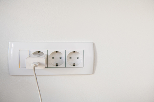 EU electric wall socket with one phone charger in