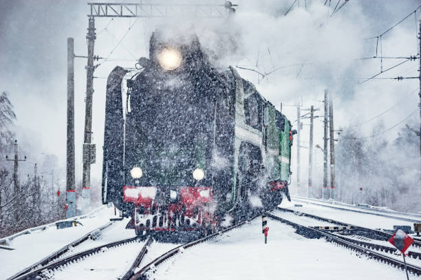 istock Retro steam train departs from the railway station. 1208545610
