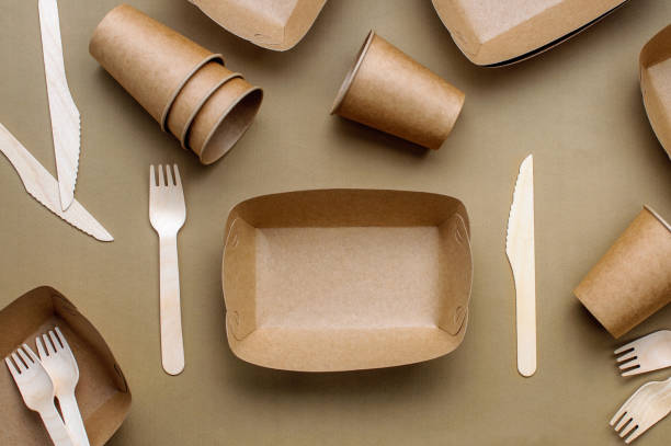 istock Brown kraft paper food containers on beige background 1208545726