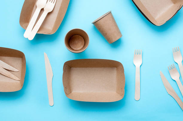 istock Brown kraft paper food containers on blue background 1208545732