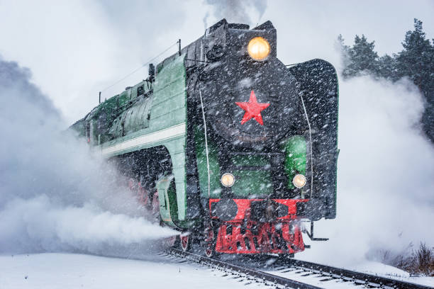 istock Retro steam train departs from the railway station. 1208545774