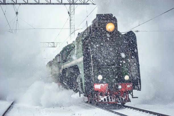 istock Retro steam train departs from the railway station. 1208545863