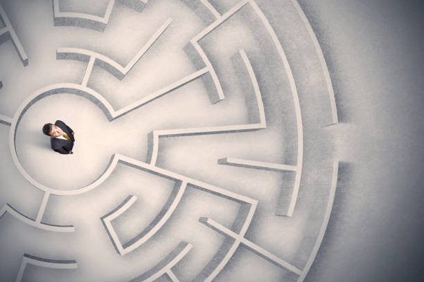 istock Business man trapped in a circular maze 1208545879