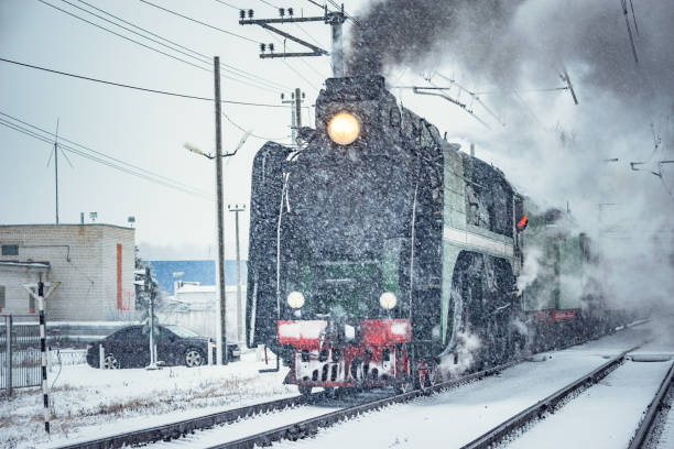 istock Retro steam train departs from the railway station. 1208546431