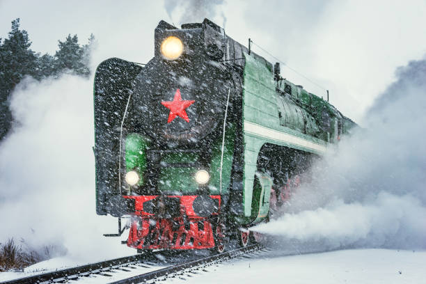 istock Retro steam train departs from the railway station. 1208546509