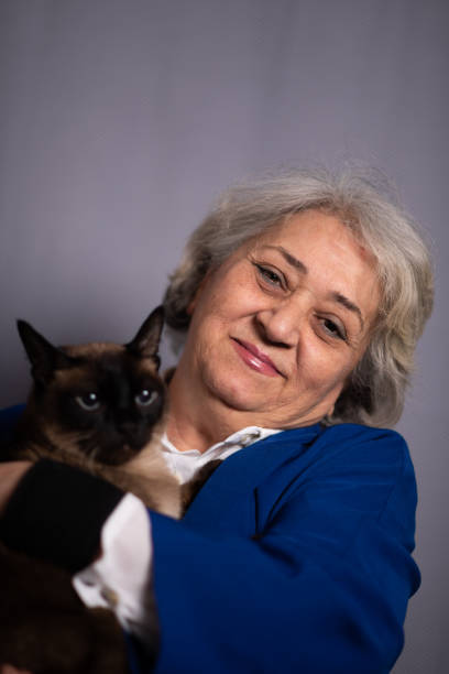 istock Kitty Loving Senior Woman 1208547058