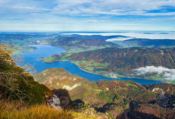 Picturesque autumn Alps mountain lakes view from Schafberg viewpoint, Salzkammergut, Upper Austria. Picturesque autumn Alps mountain lakes view from Schafberg viewpoint, Salzkammergut, Upper Austria. Beautiful travel, hiking, seasonal, and nature beauty concept scene. attersee stock pictures, royalty-free photos & images