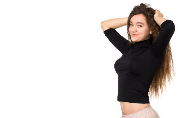 cute teenager girl with long curly hair, on a white background - human hair flowing fashion beauty spa imagens e fotografias de stock