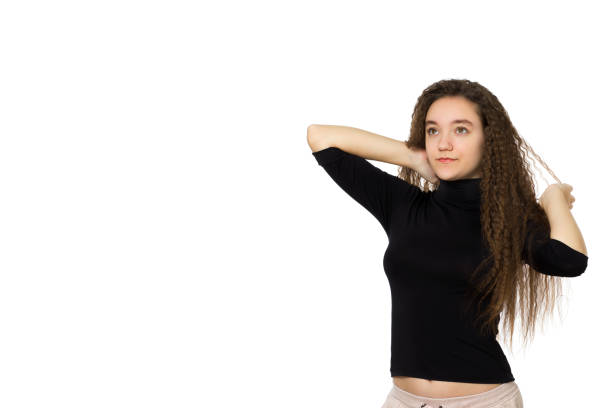 cute teenager girl with long curly hair, on a white background - human hair flowing fashion beauty spa imagens e fotografias de stock