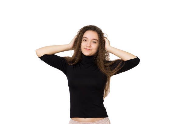 cute teenager girl with long curly hair, on a white background - human hair flowing fashion beauty spa imagens e fotografias de stock