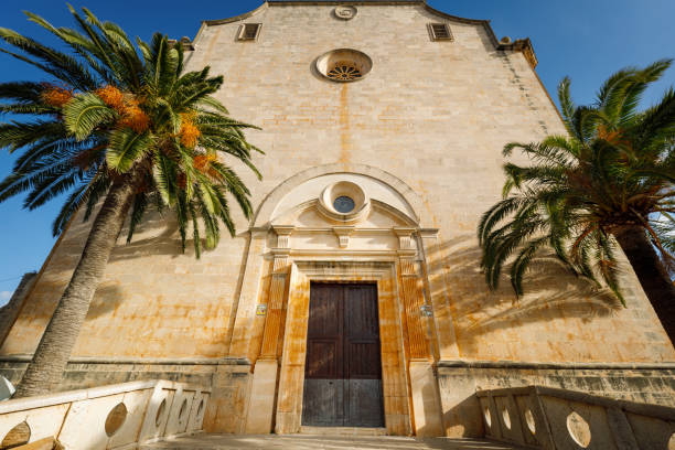 istock Entrance to the church between two palm trees 1208553350
