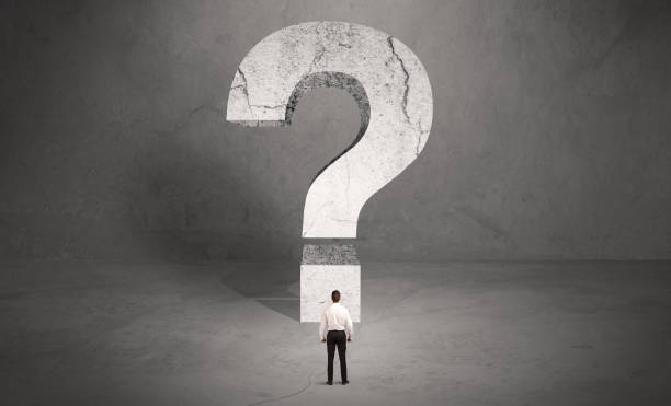 istock Confused businessman and big question mark 1208553731