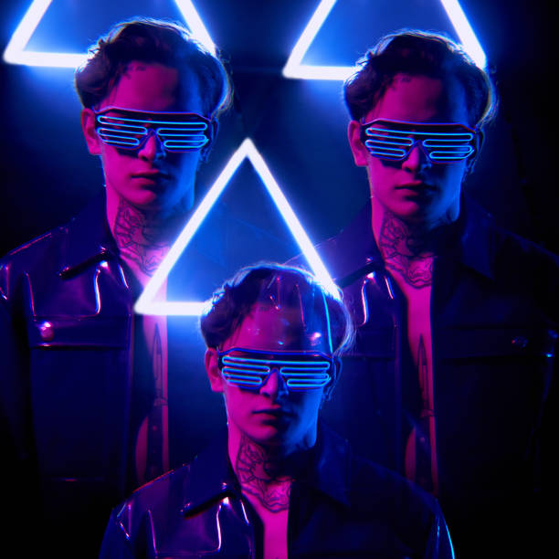 istock Cyclical composition of handsome young men in wire LED goggles standing in neon triangle light 1208553864
