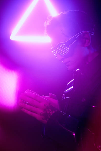 istock Side view of pensive young popular singer being in stage outfit praying before performance 1208553900