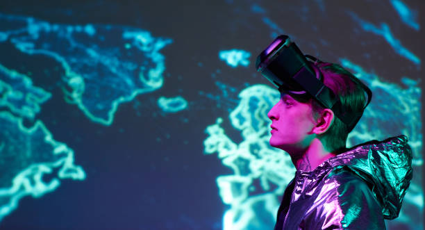 istock Side view of serious young man with VR goggles on forehead exploring world with virtual reality 1208554011