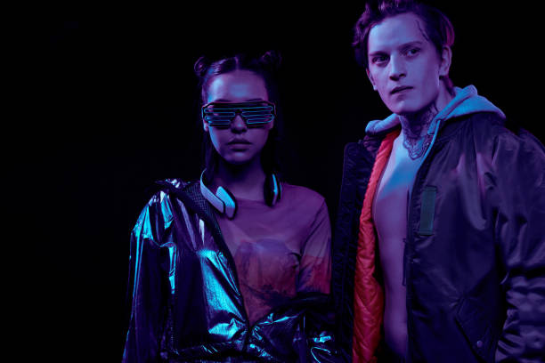 istock Cyber security agents in ultramodern outfits standing against black background 1208554621