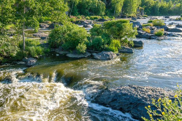 istock a small waterfall on a mountain river rapids dangerous for rafting and walking on a summer day 1208554635